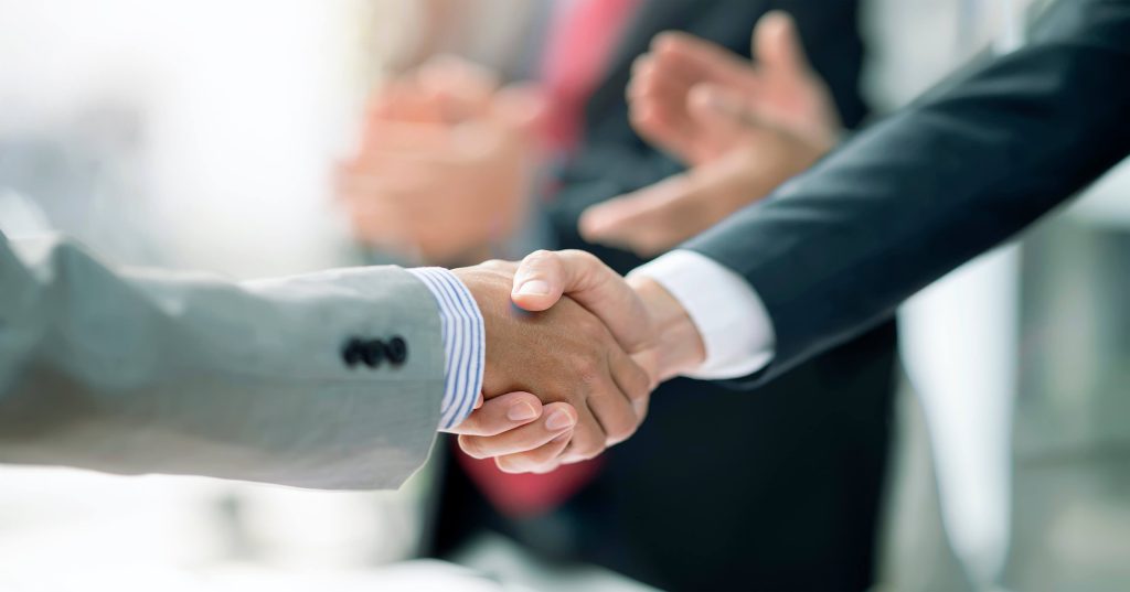 handshake representing mergers & acquisitions